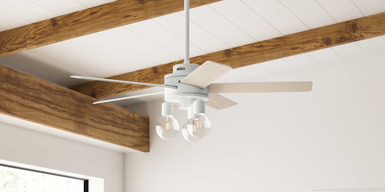 Hardwick in fresh white finish mounted with downrod on white wood ceiling.